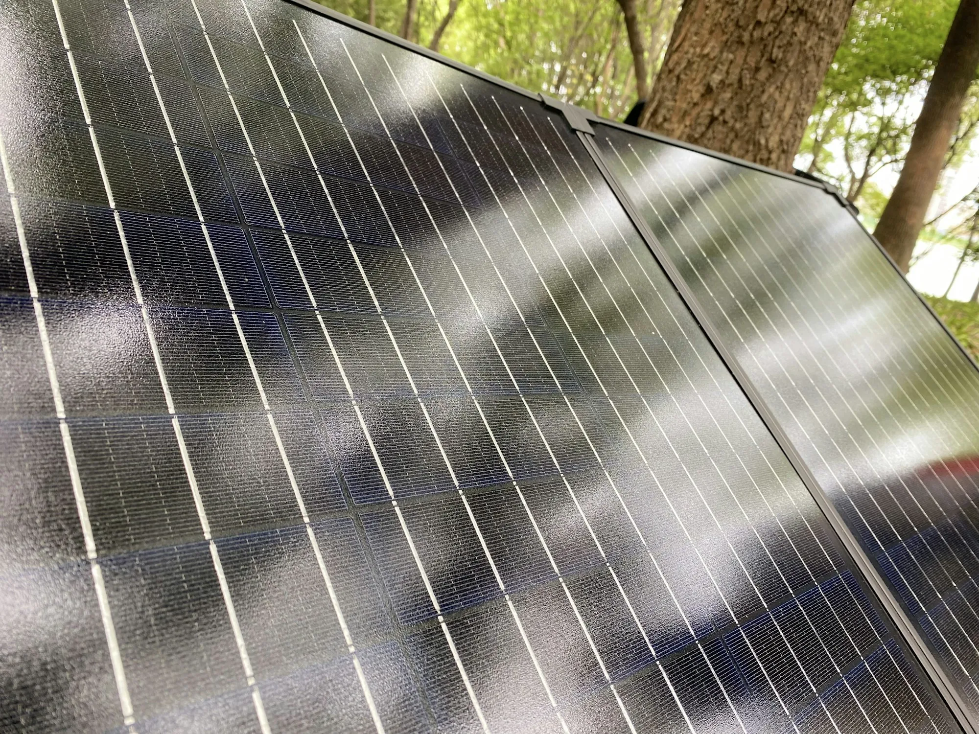 Sunlight glinting across the surface of a solar panel